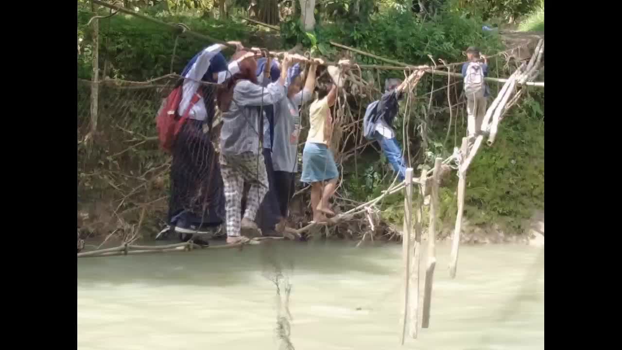 the community and students cross the damaged bridge and it is not suitable for daily activities