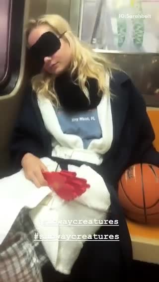 Girl asleep subway hand clapper basketball costume key west