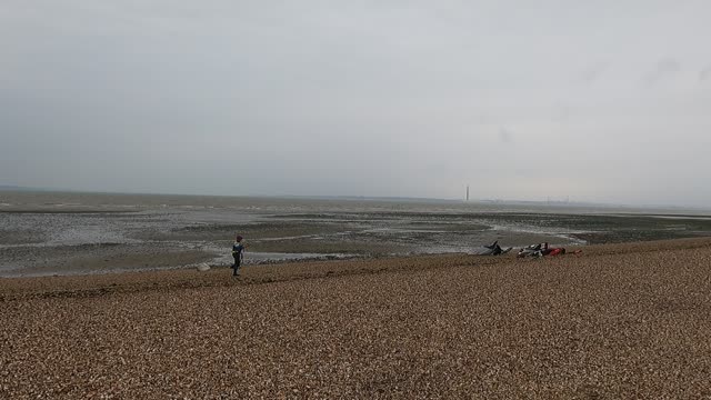 Kit surfer getting their kite ready