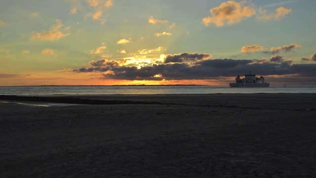 Nice Time Lapse Video Of The Sunset With People Walking On The Beach