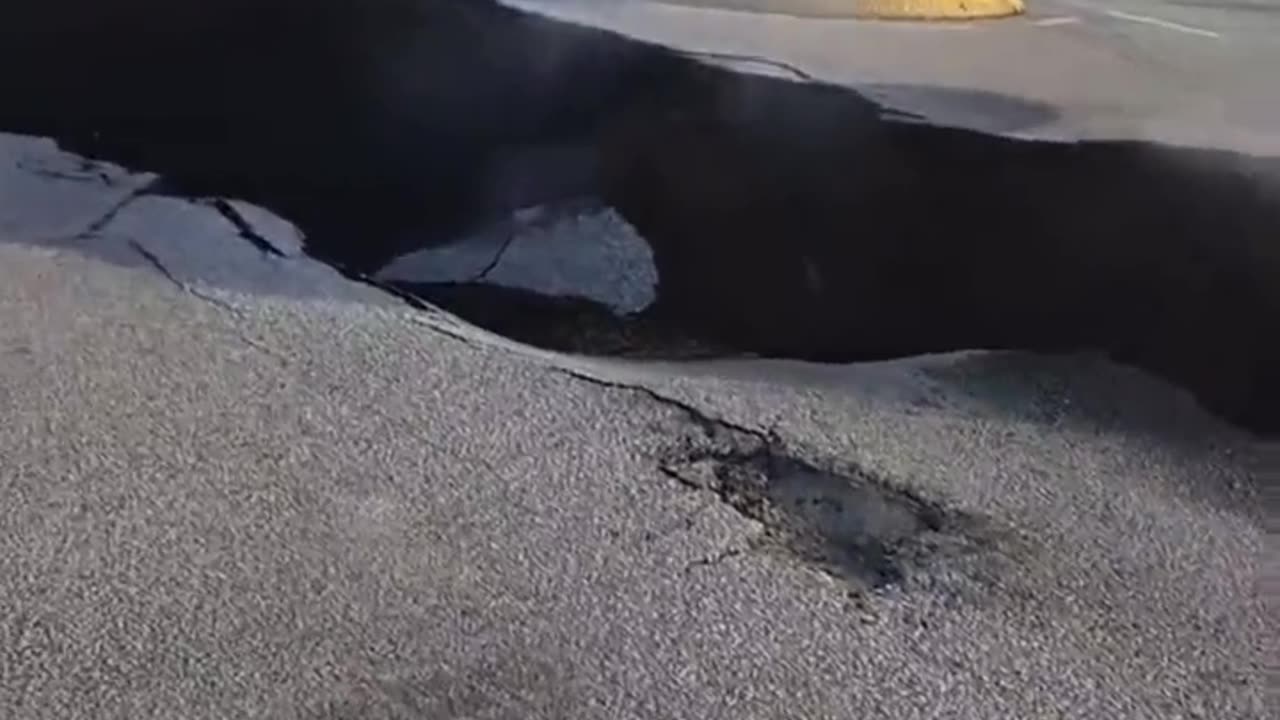 Massive crack emanating steam in Grindavik town of Iceland from a potential volcanic eruption