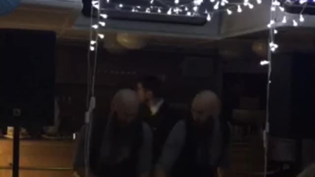 Twins DJ playing music on yacht