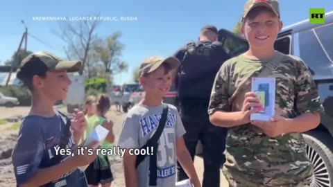 Volunteers bring supplies to Lugansk, under fire from Ukrainian forces...