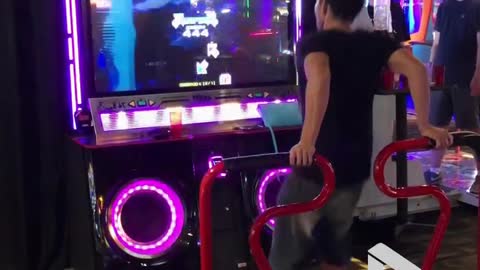 Guy nails foot dancing arcade game