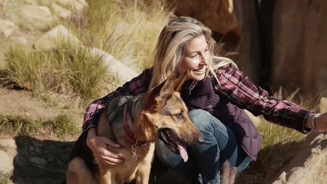 A Woman Taking A Selfie With Her Dog