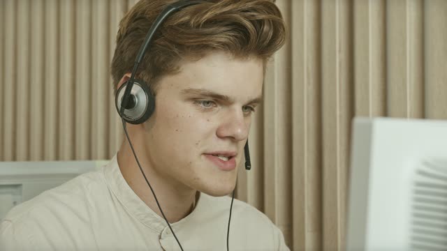 Young Man Working at Call Center