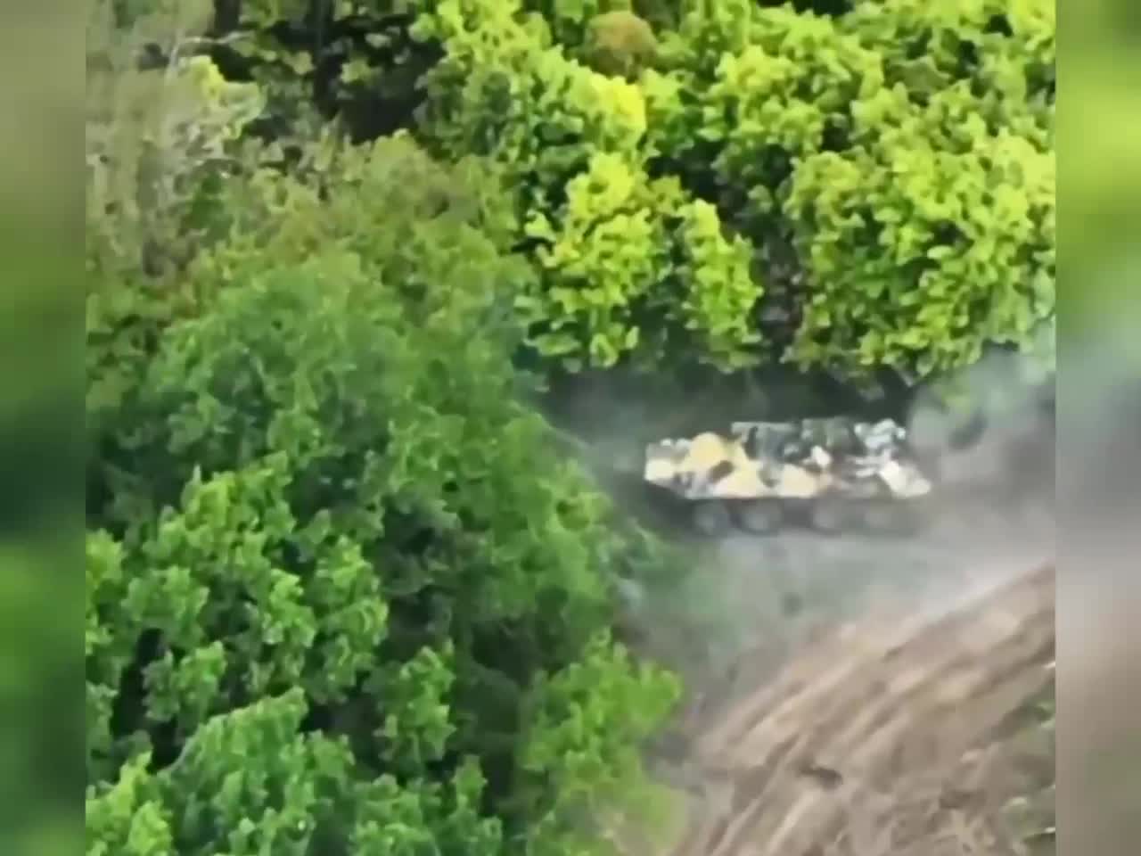 Most likely a Russian BTR-87 takes multiple anti-tank rounds and keeps fighting