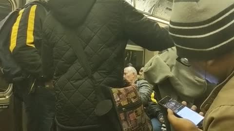 Orange beanie guy sings very well on subway