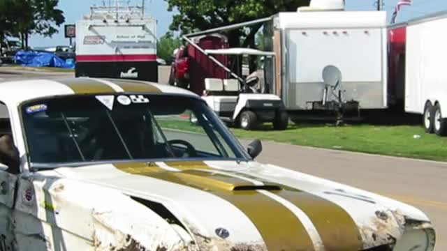 Vintage Shelby GT350 Mustang Crashes Over Tire Wall