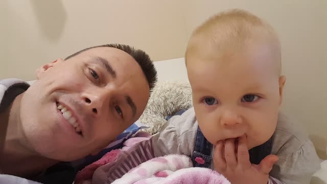 Adorable Baby Mimics Daddy and Giggles