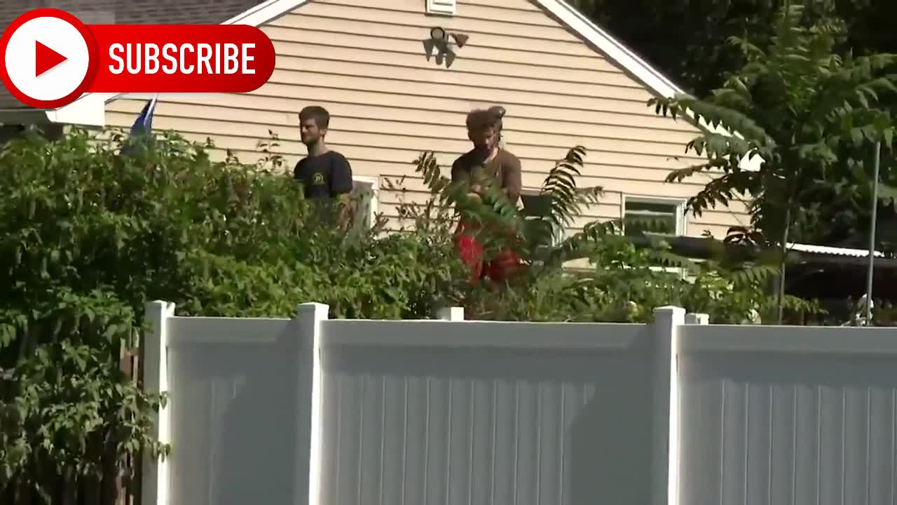 Joe Biden takes barrage of heckles from people behind Fence waving Trump flag touring Hurricane Ida