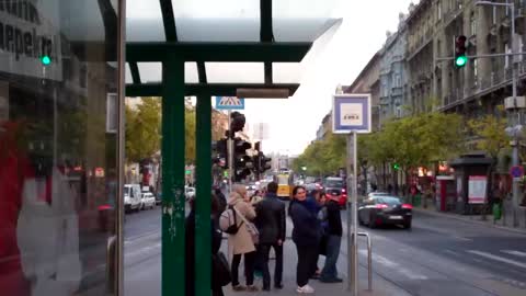 Touring Budapest 1. At a tram stop.