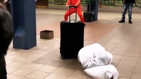 Two guys subway station dance off 