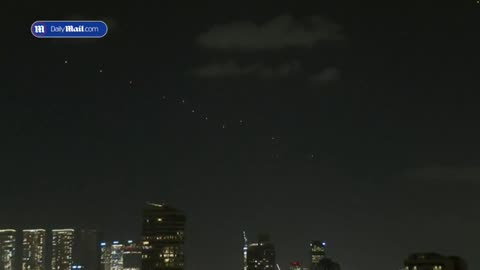 Waves of incoming Iranian missiles shoot across sky in Tel Aviv