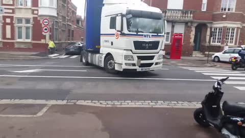 Truck Sideswipes Car on Sharp Turn