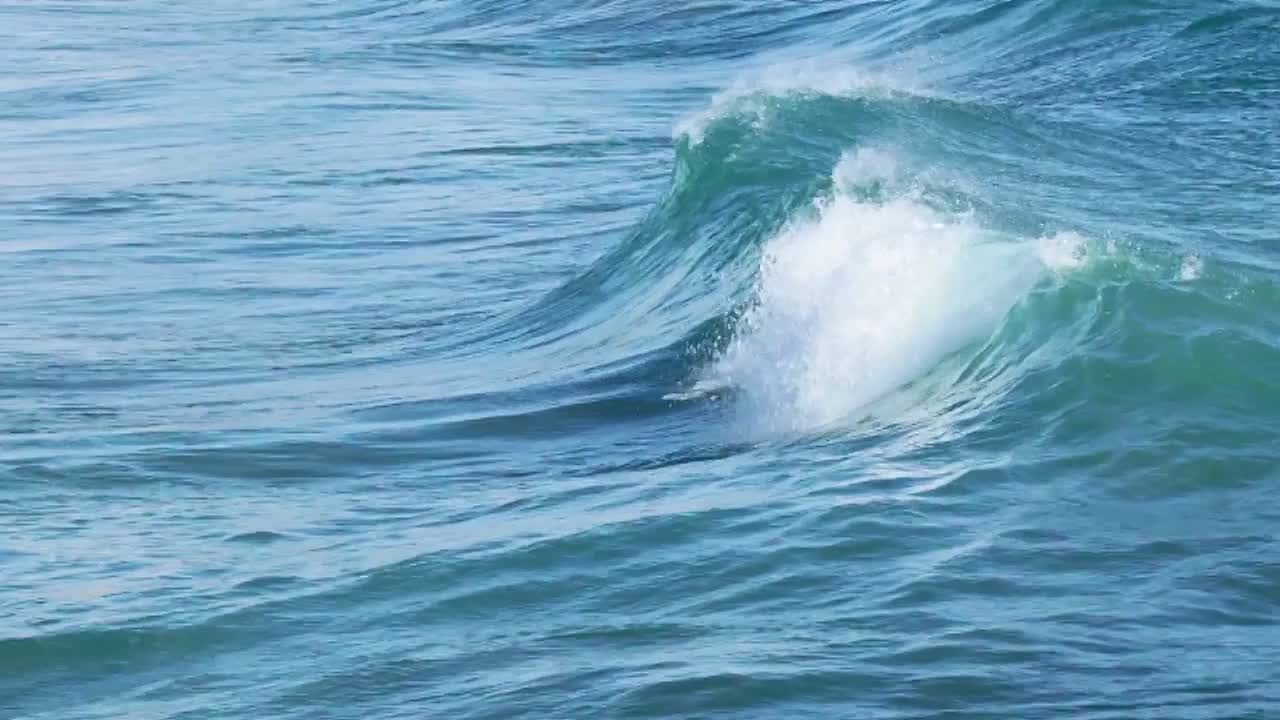 Waves of the sea beat on the beach.