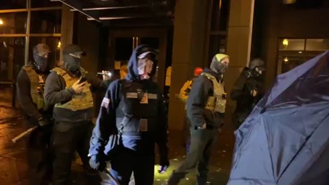 Civil War in the making. Vancouver patriots protect a police precinct from antifa.