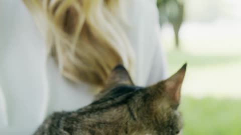 A Woman Petting Her Cat