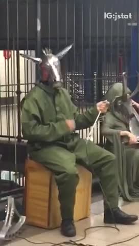 Metal horse helmet guy plays triangle music in terminal
