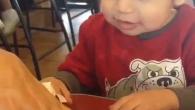 Lunch time and you know it red shirt kid reacts happily to chicken nuggets