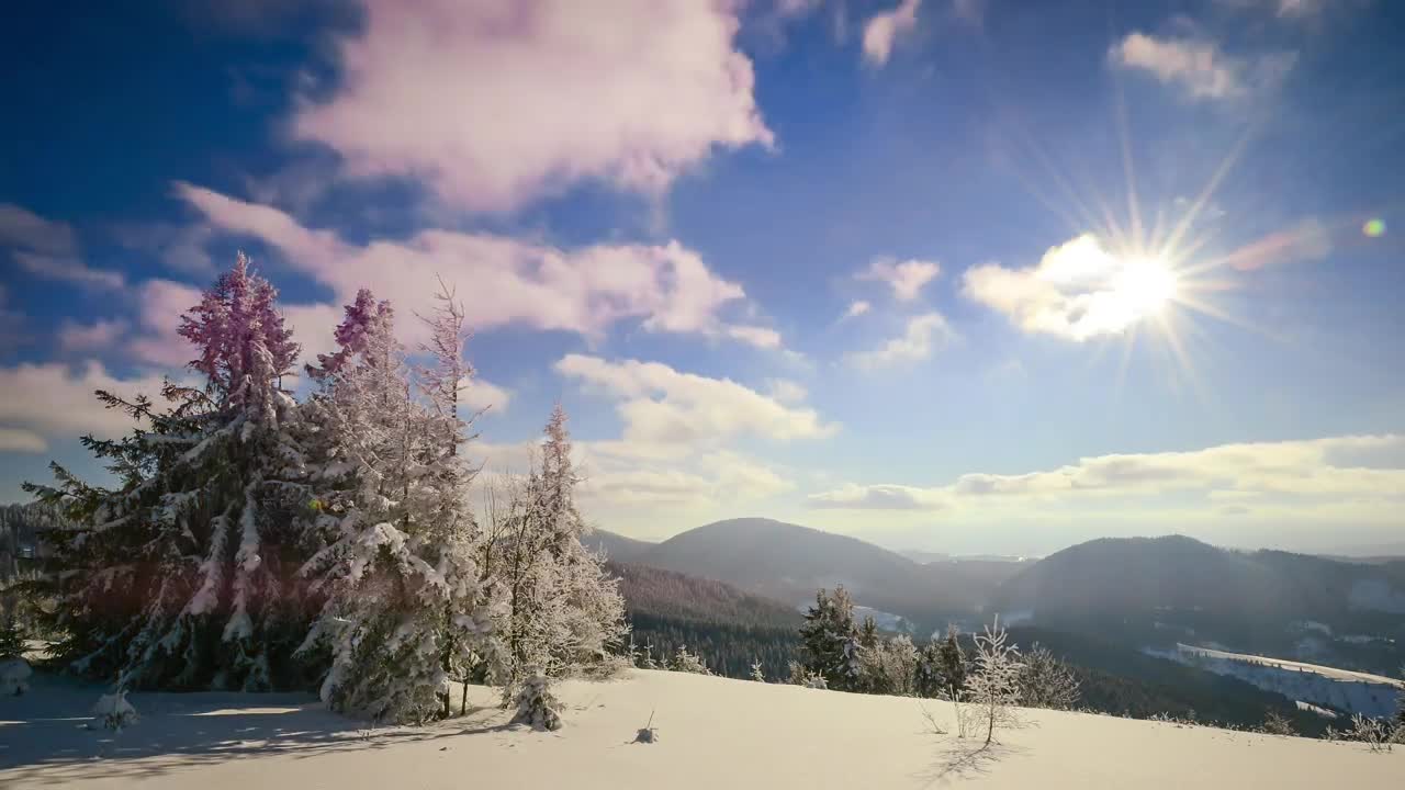 Winter mountains and the sunny sky