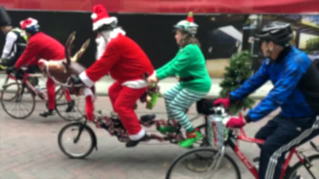 Clown men riding bicycles