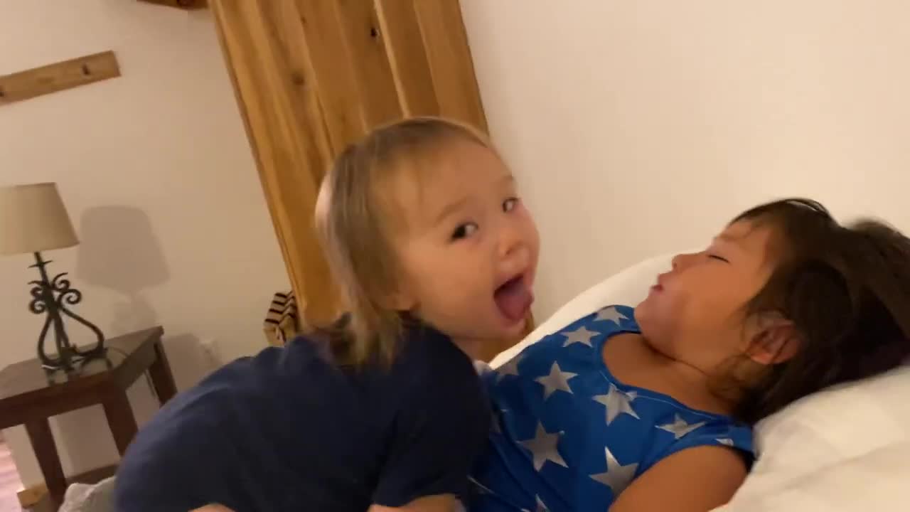 Heartwarming moment 1 year-old kissing her sleeping sister | so cute