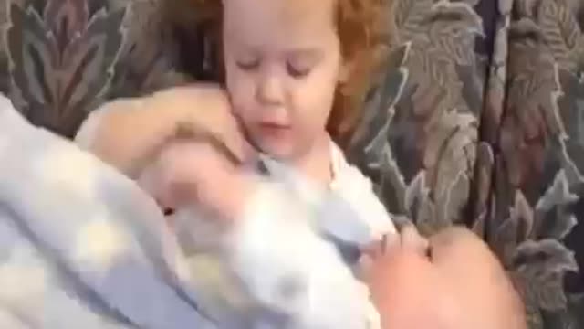 Cute toddler sibling looking after baby videos