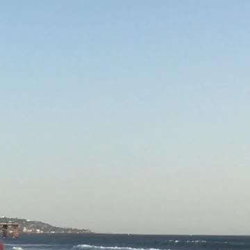 Man rides scooter on beach