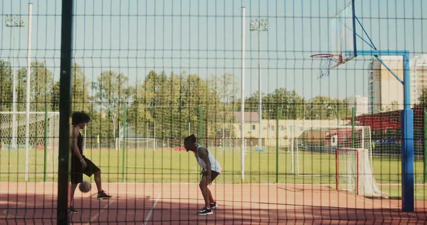 Two Men Playing Basketball