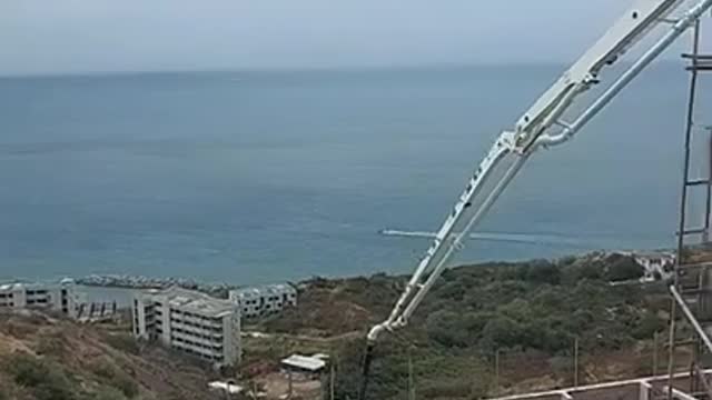 Construction with Concrete Truck on Hillside