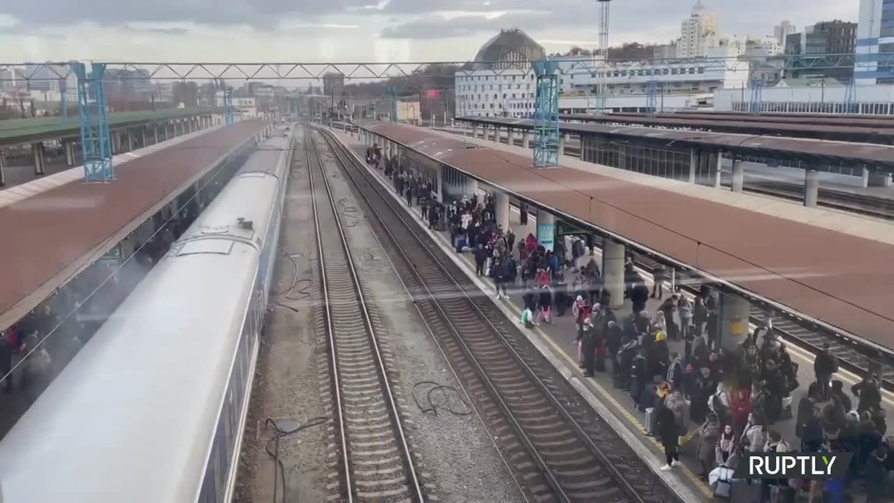 Ukraine: Locals queue up at railway station to evacuate Kiev as air raid sirens wail