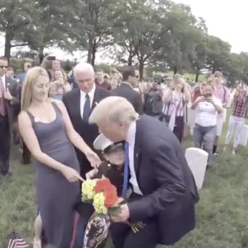 President Trump visits grave of fallen and meets his son