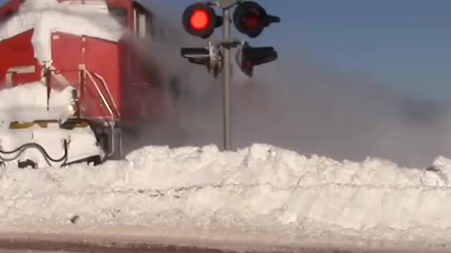 Train speeds through deep snow