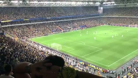 Turkish fans chant "Vladimir Putin" during a football match between Fenerbahce and Dynamo Kyiv