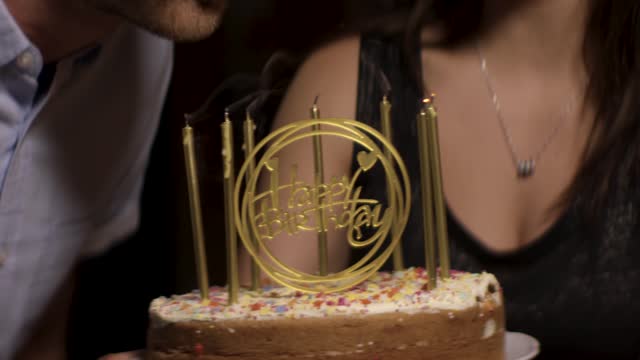 CU Man Blows Out Birthday Cake Candles