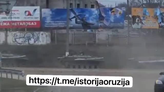 Ukrainian civilians fleeing by car amidst tanks on the streets. #Ukraine - 14