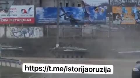 Ukrainian civilians fleeing by car amidst tanks on the streets. #Ukraine - 14