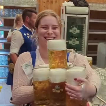 Woman Expertly Picks Up Beer Steins