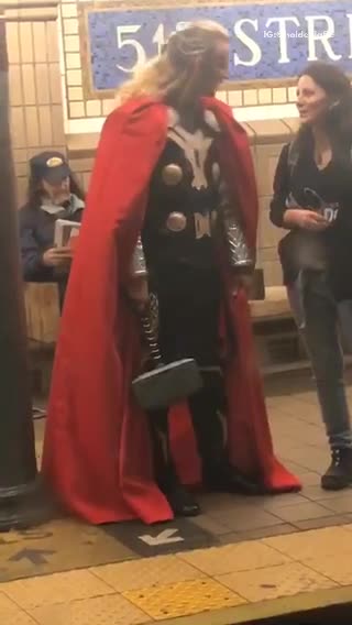 Man dressed as thor on subway station