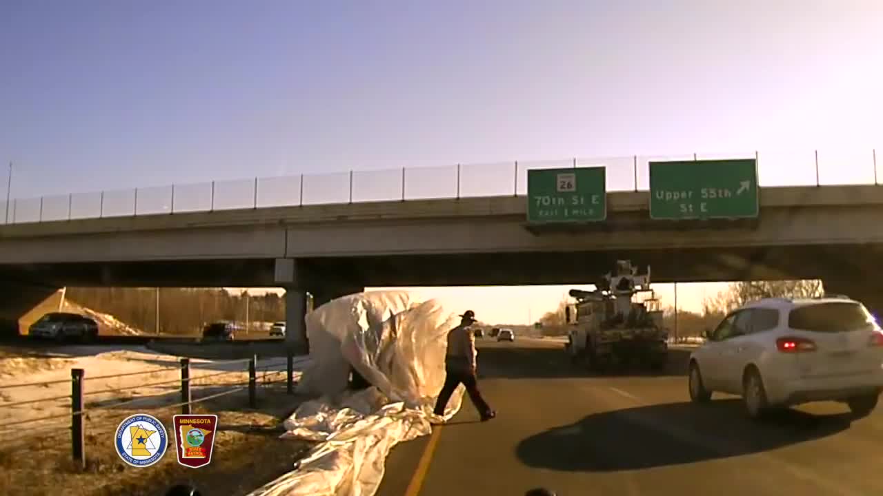 Unsecured Sheet Of Plastic Flies Off Of Truck And Totally Engulfs SUV