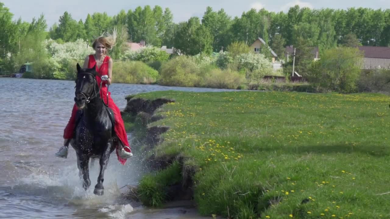 Girls on horseback along the shore