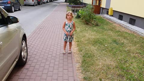 Little Girl Demonstrating How Penguins Run