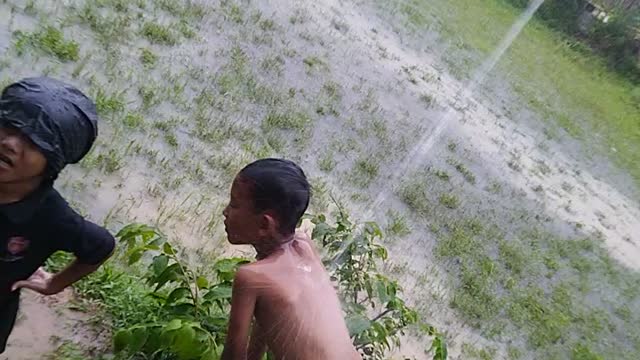 Funny Kids enjoying the Rain