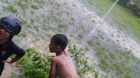 Funny Kids enjoying the Rain