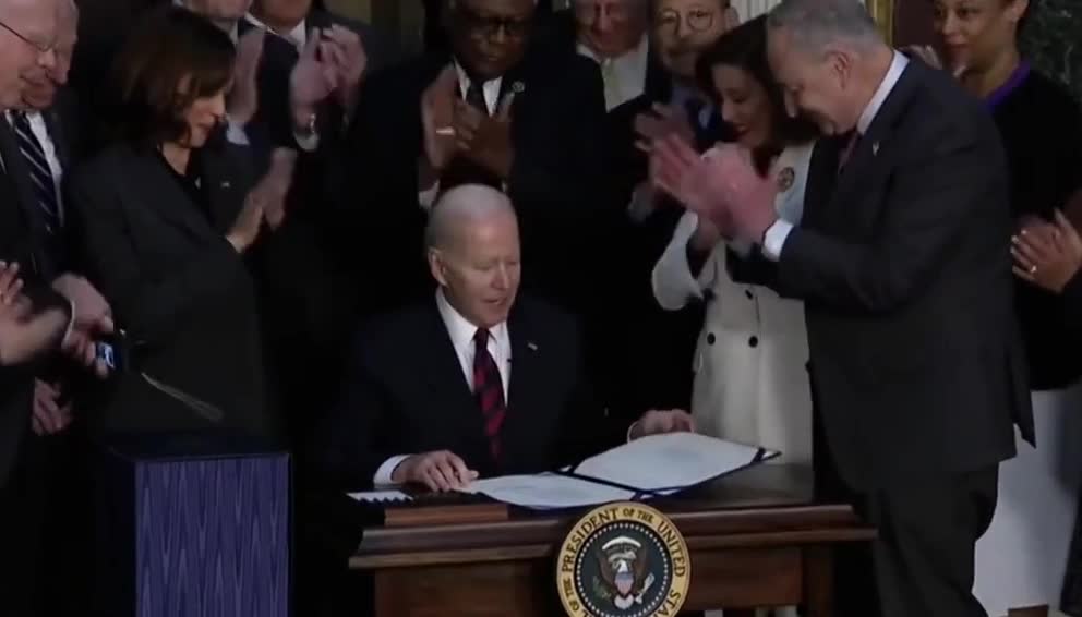 The swamp crowds around pedojoe as he signs the $1.5T Consolidated Appropriations act of 2022.