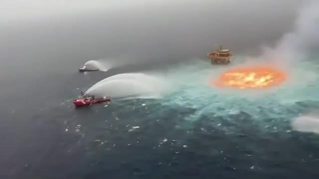 This is not animation. A pipe recently burst in the Gulf of Mexico and the ocean is on fire.