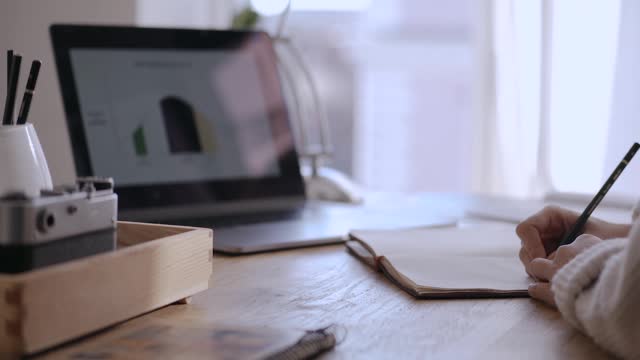 Video of a Person Writing in Paper