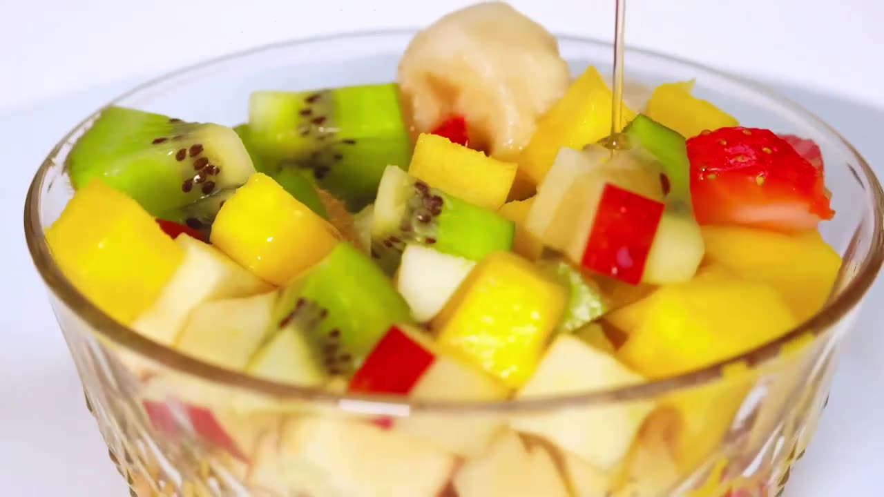 Rotating bowl with fruit on a white background