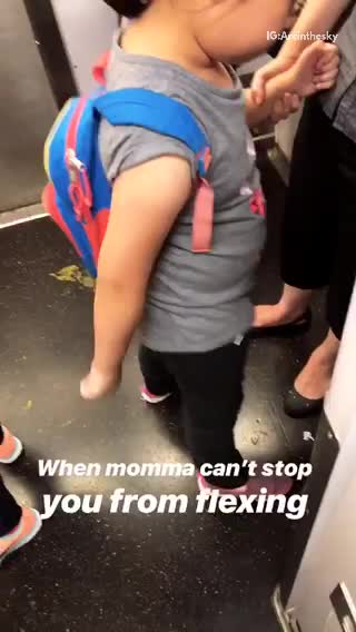 Little girl subway doing the floss with one arm glasses